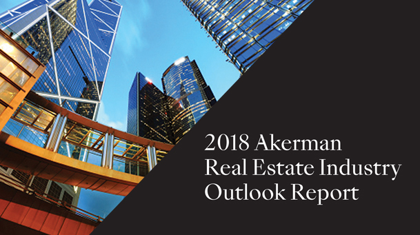 2018 Akerman real estate industry outlook report text with photo of buildings