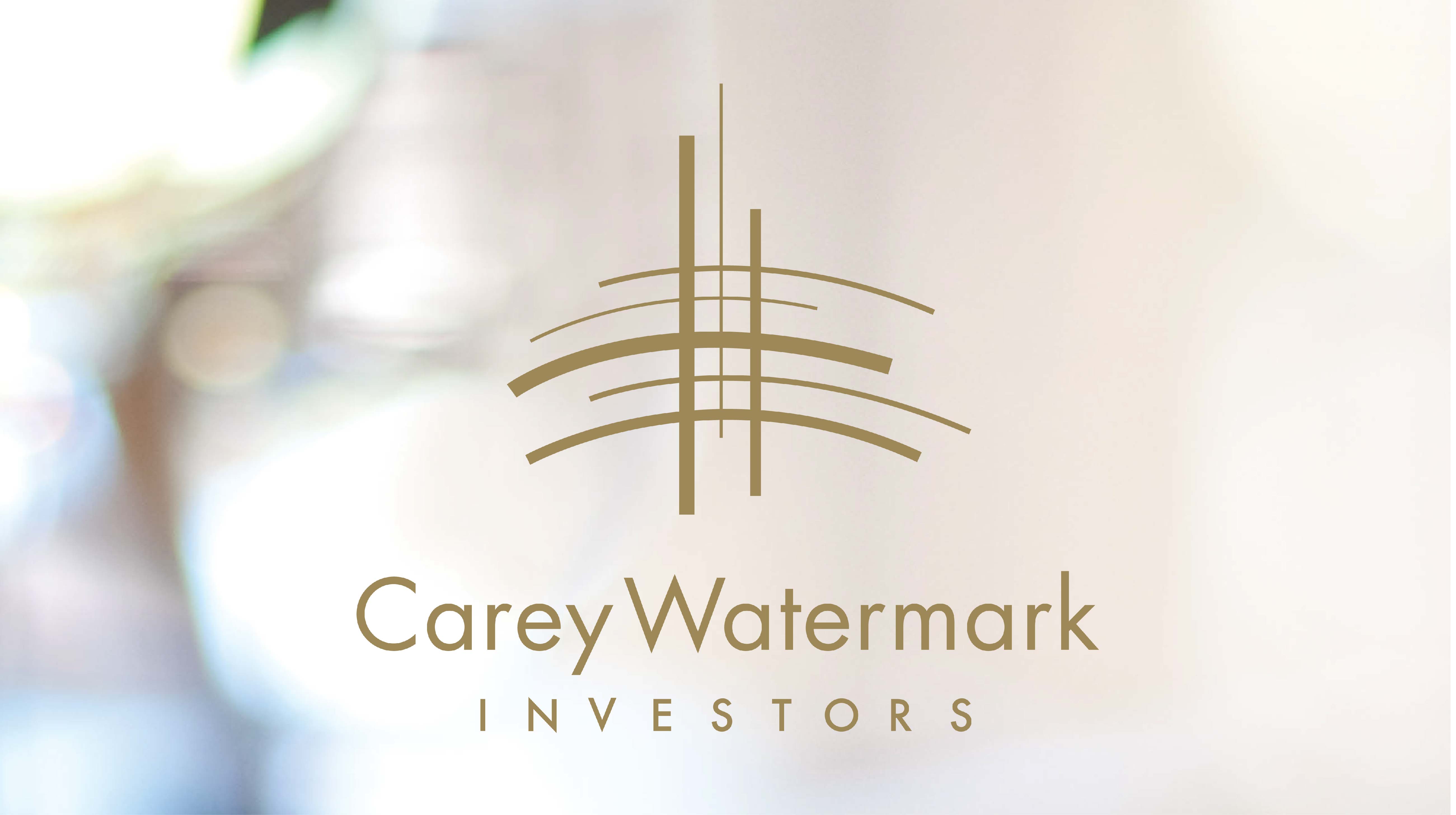 carey watermark logo on a blurry colorful background