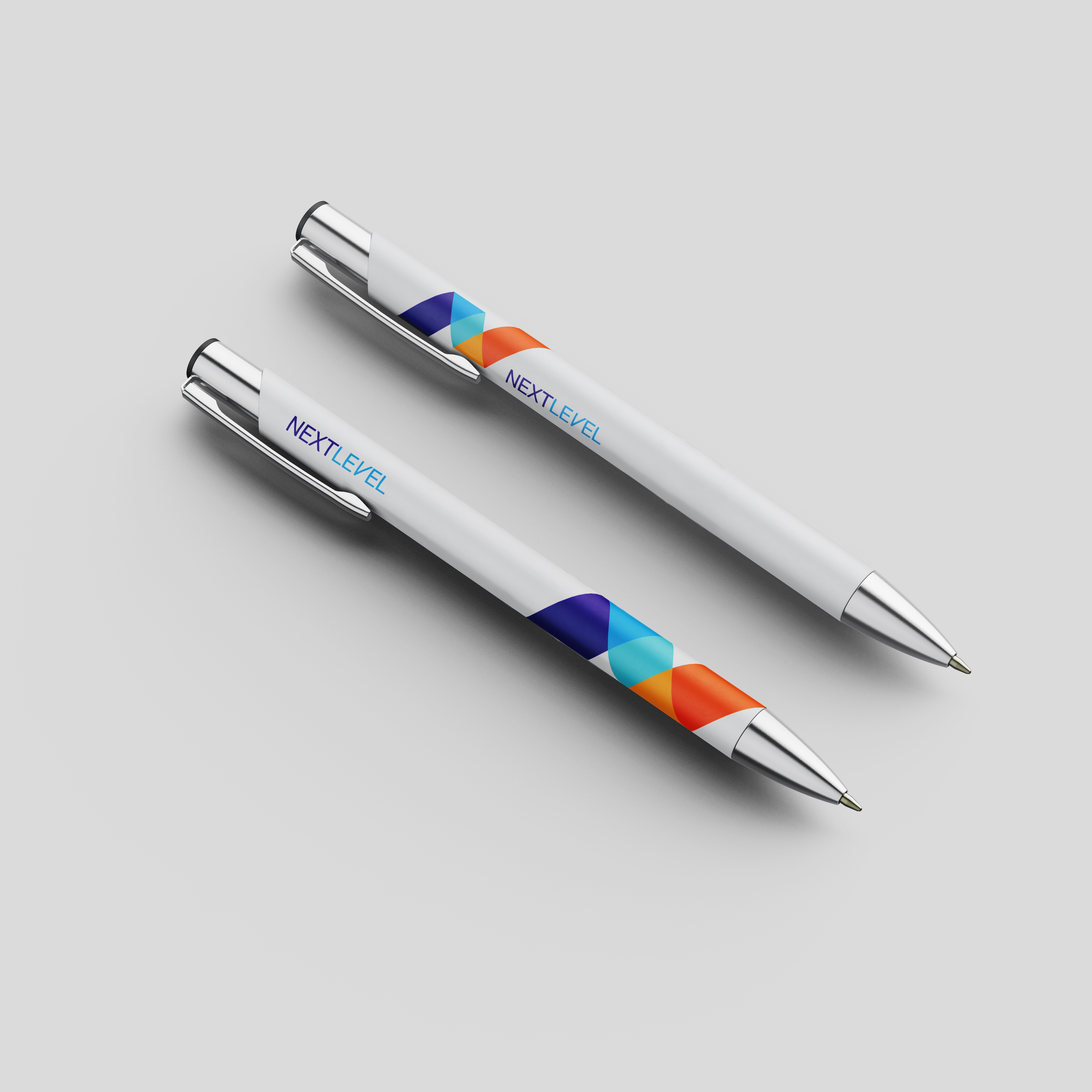 2 pens with the NBCU Next Level logo on them